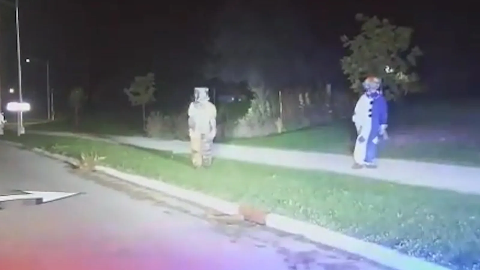 Night image of two clown figures